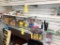 LOT CONSISTING OF BEAUTY PRODUCTS, WIG CAPS, HAIR THREAD, LIP GLOSS, MASCARA, (2) SHELVING UNITS AND