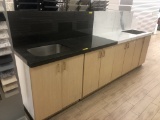 CABINET DISPLAY WITH GRANITE COUNTERTOPS AND