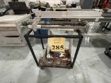 CUSTOM-MADE FIXTURE ON ROLLING RACK