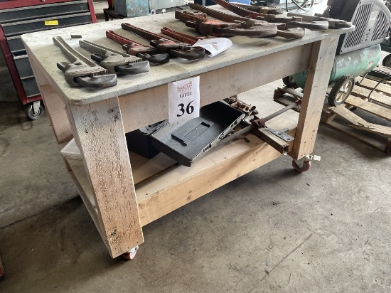 ROLLING WOOD WORK TABLE WITH ASSORTED PIPE