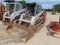 SKID STEER, 13'' RUBBER TRACKS, OPEN CAB, 72'' 4 & 1 BUCKET AUX HYD OUTLETS