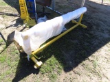 Metal frame w/wheels w/roll of plastic