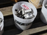 Bucket of stainless steel T-fittings