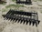 Skid steer root rake