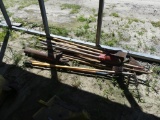 Assortment of shovels, rakes, garden tools