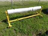 Metal frame w/wheels w/roll of clear plastic