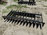 Skid steer root rake