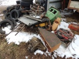 Misc scrap iron and parts, located around the exterior of building, also in