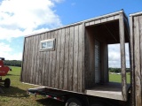 10x12 shed with roll up door and side door plus 4 ft deck area