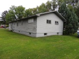 Lot 7: 405 5th St SE.  Rambler style home with wood siding, 26x48 home, 3 b