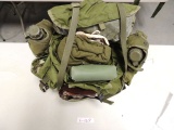 ruch sack with sewing kit, razor blades, canteens, army blanket, food ratio