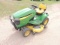 John Deere X320 riding lawn mower, 48 inch cut, 400.5 hours showing, tear i