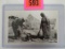 Antique Black and White (RPPC) Real Photo Postcard of Sioux Indians Cooking A Dog