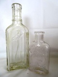 2 Antique Embossed Glass Apothecary/ Veterinary Bottles