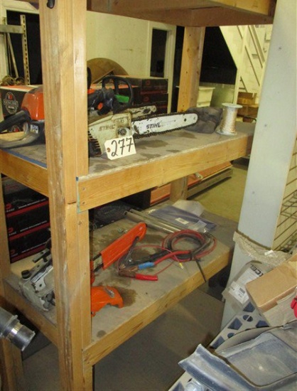 Wood shelving w/ Stihl chainsaw parts