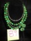 Green beaded necklace and clip earrings