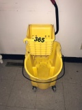 Janitors mop bucket