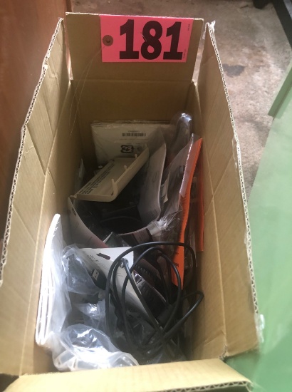 Box of new phone cords, battery packs, & misc.