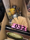 Box of spices, stir sticks, measuring cups