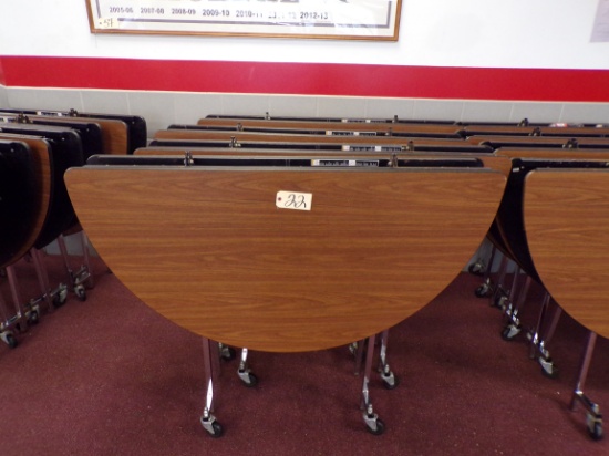 (4) 5ft. round folding cafeteria tables on wheels