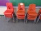 (12) Orange school chairs