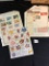 Assorted stamps and uncut sheet of stamps