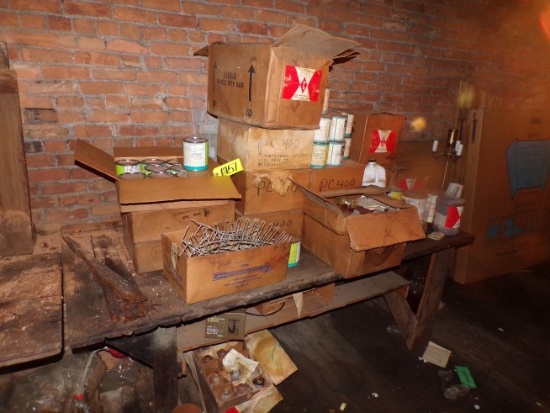 Antique workbench & contents: cases of concrete sealer & others