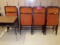 (11)Padded folding chairs & (2) Student desks (Maintenance Hallway)