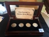 Four Centuries of American silver dollars in box, 1783, 1891, 1922, 2013