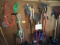Large lot contents of pegboard: Elec trimmer, ext. cord, long handled tools