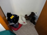 Contents of closet: Bedding, mens boots, bear slippers, bed pan
