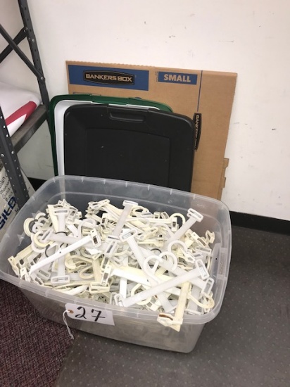 Plastic tube of hangers, lids, boxes, chair mat