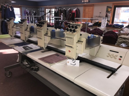 (4) Melco Embroidery machines and 8 ft. embroidery table on wheels