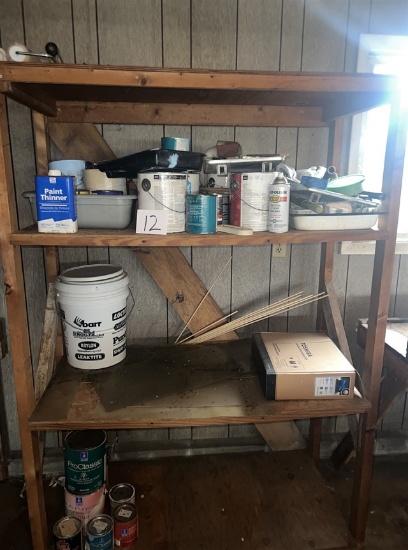 Wood garage shelving and contents: painting supplies