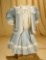Blue linen jacket dress with fine lace and broderie Anglaise trim. $400/500