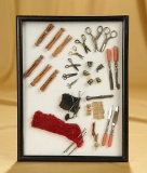 Miniature sewing tools in original presentation frame. $400/400