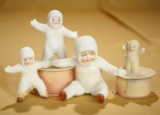 Lot of four German bisque Snowbabies and candy containers. $200/300