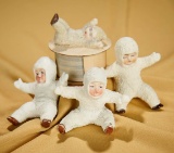 Lot of three seated German bisque Snowbabies and a candy container. $200/300