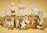 Ten petite German bisque action Snowbabies.