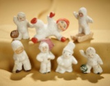 Group of miniature frolicking German bisque Snowbabies including rare hockey player. $200/400