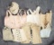 Collection of seven stays and corsets for bebes and poupees. $300/400