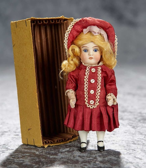 6" German all-bisque miniature doll with original wig and box. $400/500