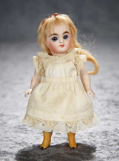 6" German all-bisque miniature doll with rare yellow ankle boots. $400/500
