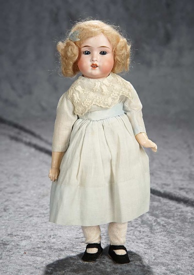12" German bisque child, 1906, by Schoneau and Hoffmeister in pretty dress. $300/500