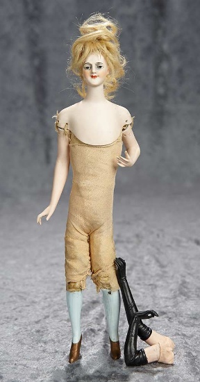 11" German bisque flapper lady with original bisque arms and legs. $400/500