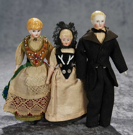 7" Trio of German bisque dollhouse dolls in original costumes. $600/900