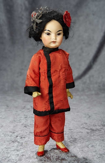 14" German bisque Asian child with amber tinted complexion, original distinctive body. $400/500