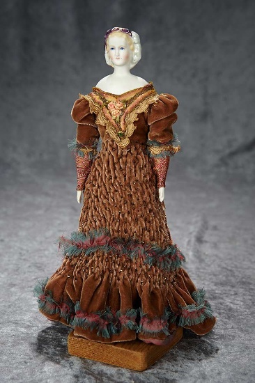 12" German bisque lady doll with sculpted hair, snood and purple lustre trim. $600/800