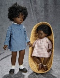 Two brown-complexioned Sasha dolls in original boxes. $300/400