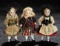 A Trio of German All-Bisque Miniature Dolls in Original Costumes 500/800